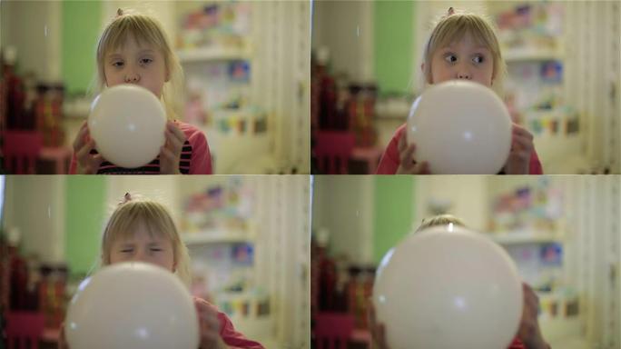 一个给气球充气的小女孩。