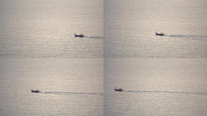 泰国渔夫在日落时在海里为鱼航行。全高清