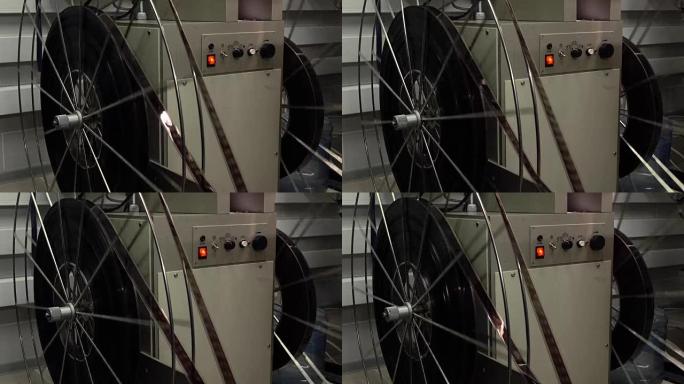 专业电影投影仪的大旋转卷轴的多莉镜头，全高清视频，场景的一部分