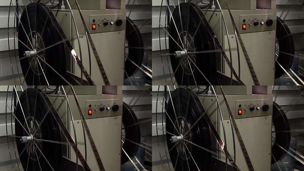专业电影投影仪的大旋转卷轴的多莉镜头，全高清视频，场景的一部分