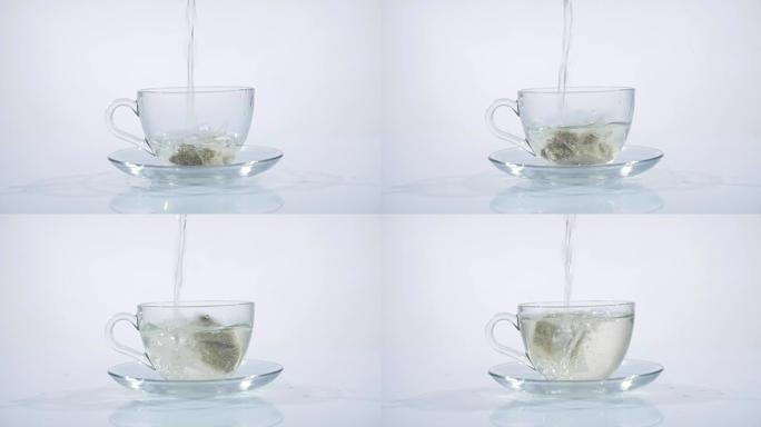 茶袋放在玻璃杯里，里面装满热水泡茶。慢动作