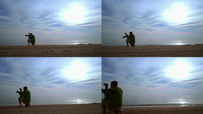 摄影师拍摄海洋日落的照片。海上日落时相机的摄影师