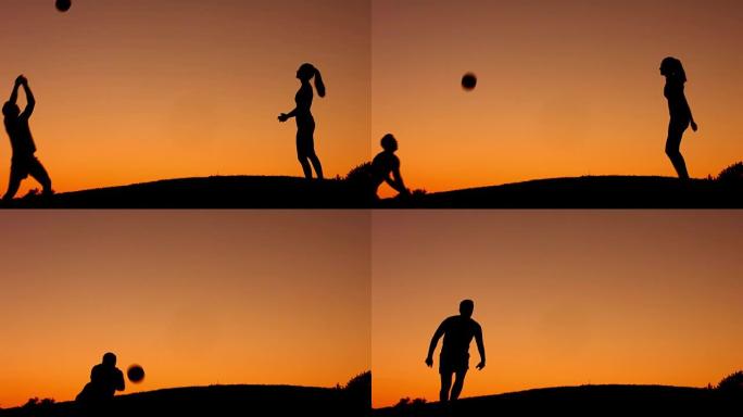 男孩和女孩在大自然中打排球。