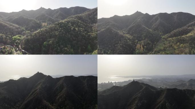 航拍初夏时节威海里口山的青翠山野