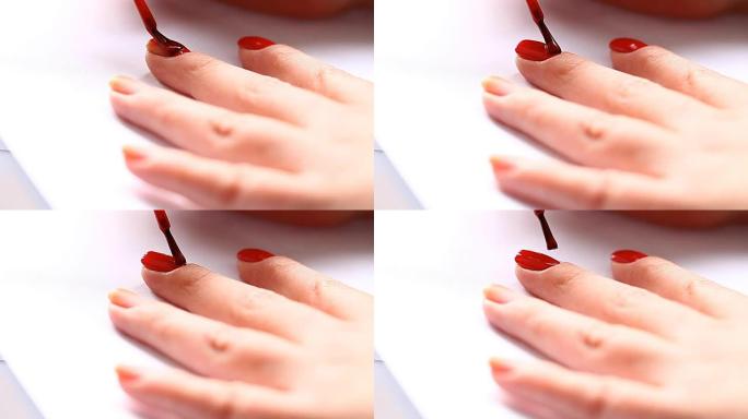 女人用红漆涂指甲