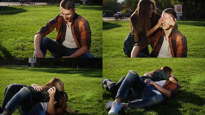 年轻人坐在草地上他的女朋友来了，闭上眼睛惊讶