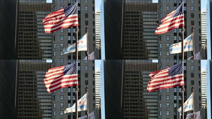 日落时分芝加哥飘扬的美国和芝加哥旗帜