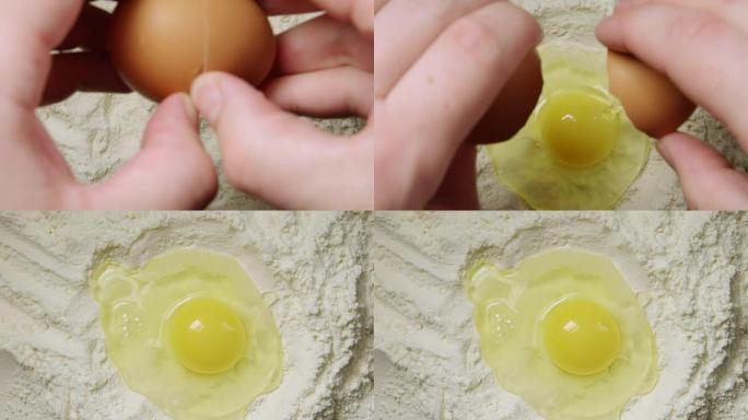 俯视图: 人的手在面粉上扔鸡蛋