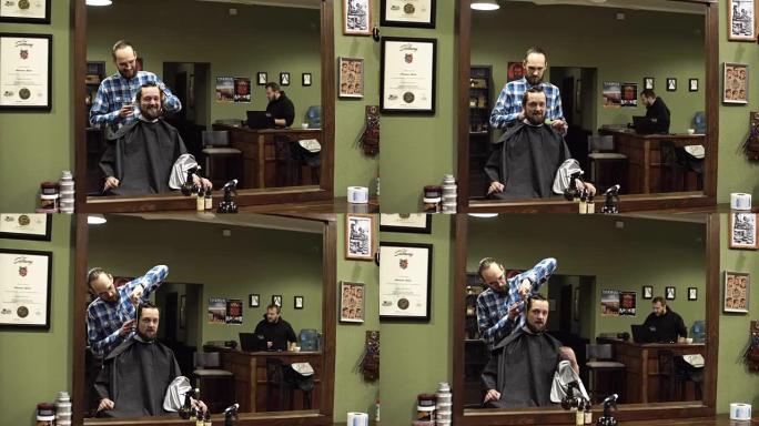 男理发师和客户正在谈论理发，微笑和大笑