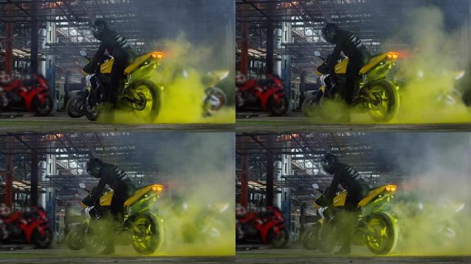 超级运动摩托车做轮胎与彩色的沙子烧坏。缓慢的运动。
