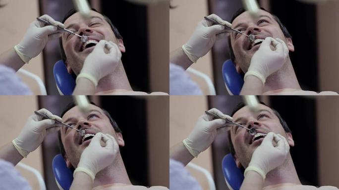 牙科医生在牙科诊所进行治疗过程。