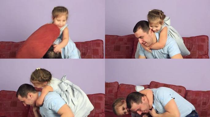 快乐的父亲和女儿在沙发上打架枕头