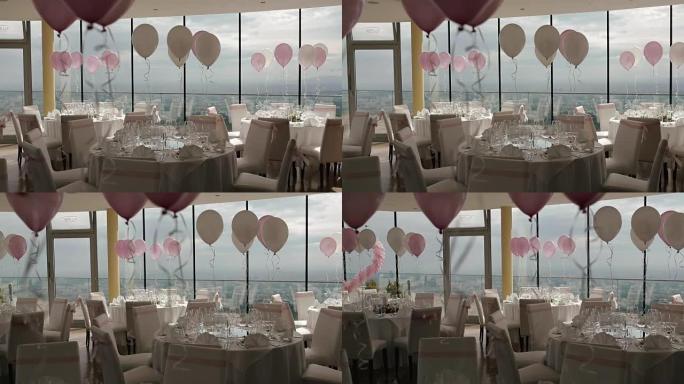 美丽的婚礼大厅装饰着气球、丝带和鲜花