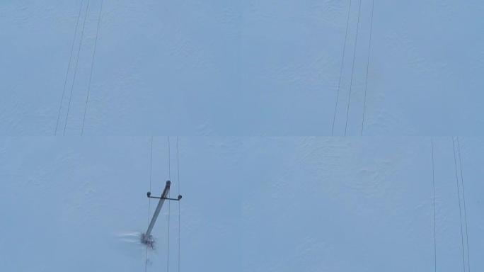 冬季电线和小电力线挂架的航拍视频。顶视图