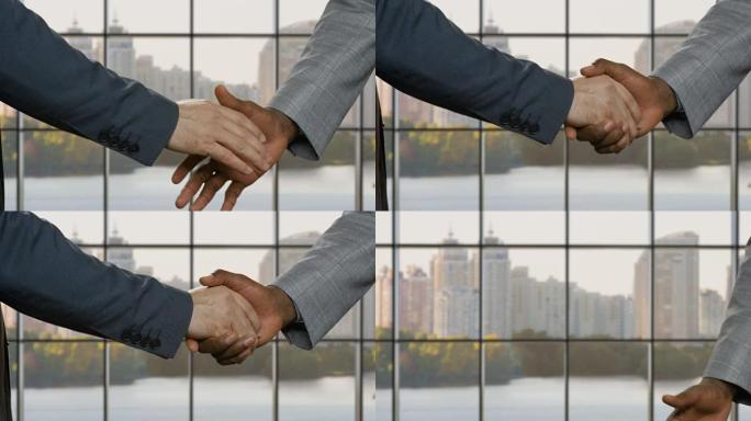 商人在总部握手。