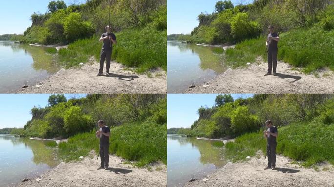 湖上戴着眼镜的人。那家伙在钓鱼竿上扭动线圈，然后将其从水中取出，没有渔获。渔夫没有钓到鱼