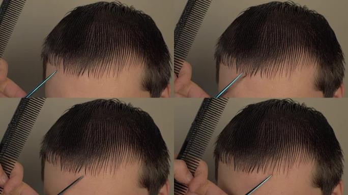 男性理发师剪客户的湿头发