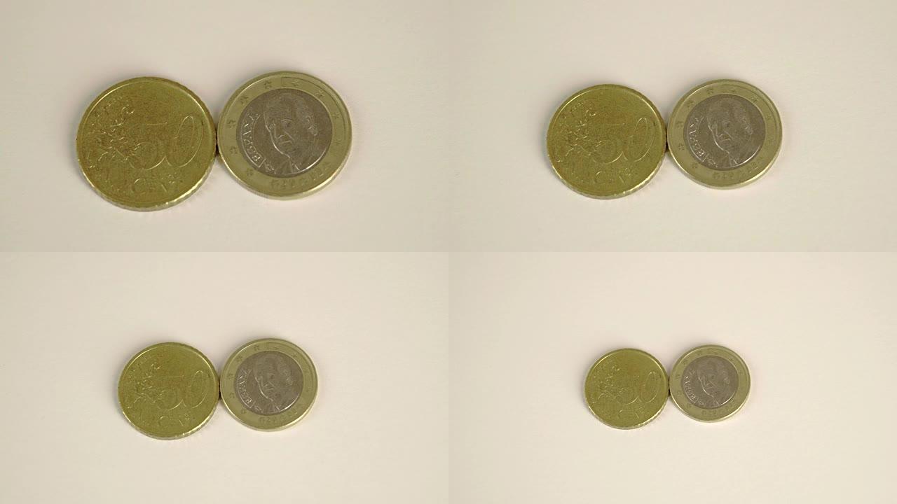 两枚欧元硬币背面是50西班牙分币，正面有细节