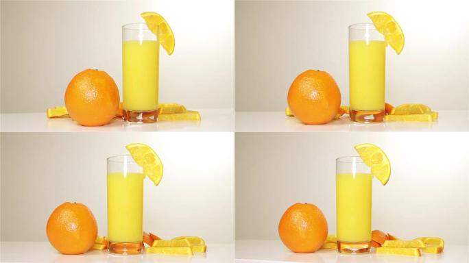 桌子上的橙汁和橙汁旋转