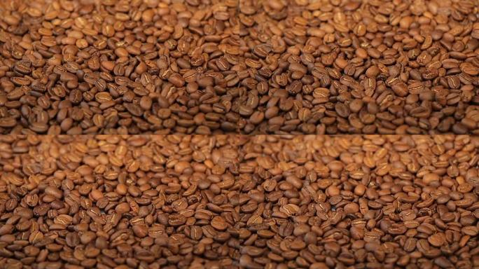 咖啡豆，一堆烘焙过的咖啡豆旋转。特写
