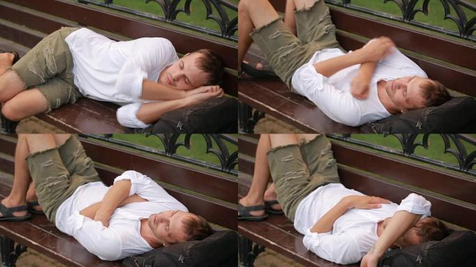 女孩叫醒长凳上熟睡的男人。男子从睡眠中醒来