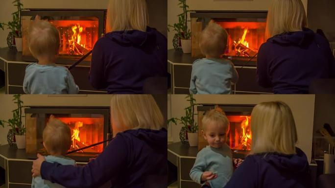 小孩和他妈妈正在看壁炉