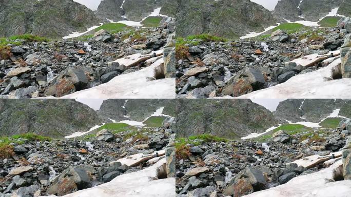 高雪山上有溪流的岩石景观。卡夫卡兹地区