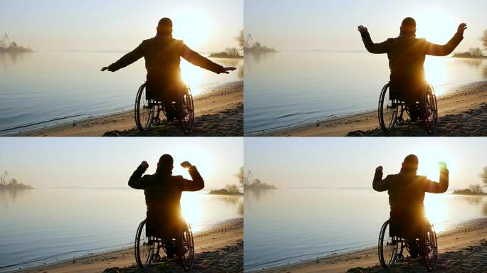 残疾人举起双手，日落，孤独