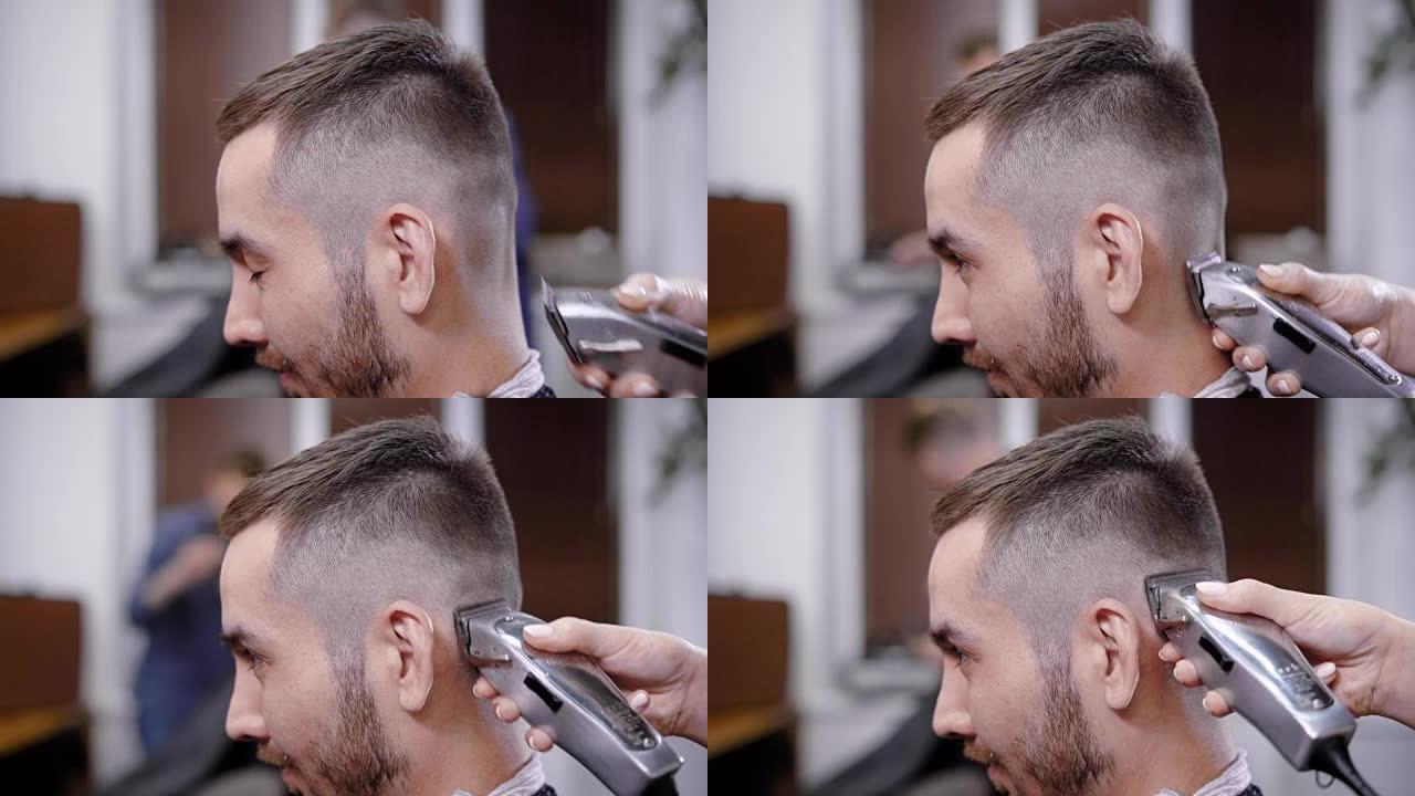 沙龙时尚客户头上使用修剪器的无法识别的理发师之手