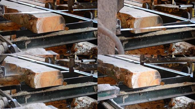 锯木厂。锯木厂机加工原木的过程锯树干