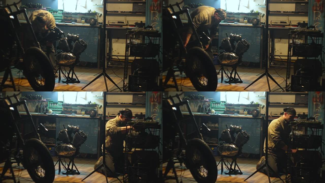 汽车修理工在他的车间组装定制摩托车