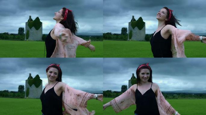 4k城堡背景拍摄的一个女人旋转快乐