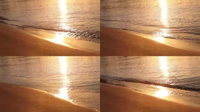黎明时在热带海滩上的波浪，早晨在海上，日出在沙滩上，橙色的阳光，海滩和海洋的日落，日落时的大海，黎明