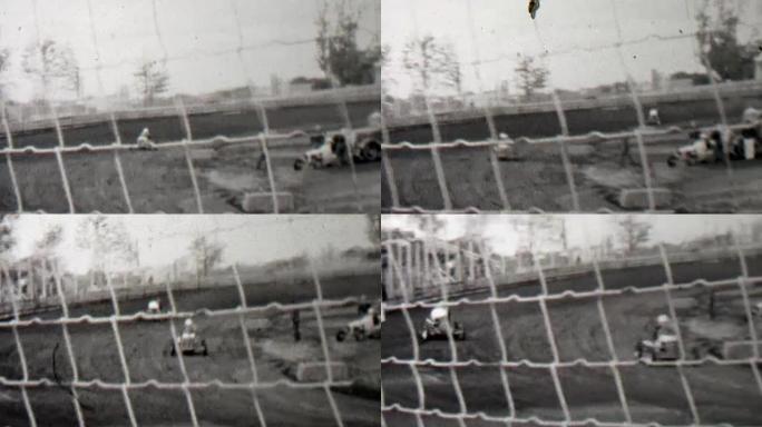 1939: 赛道车去卡丁车赛车后面细线安全栅栏。