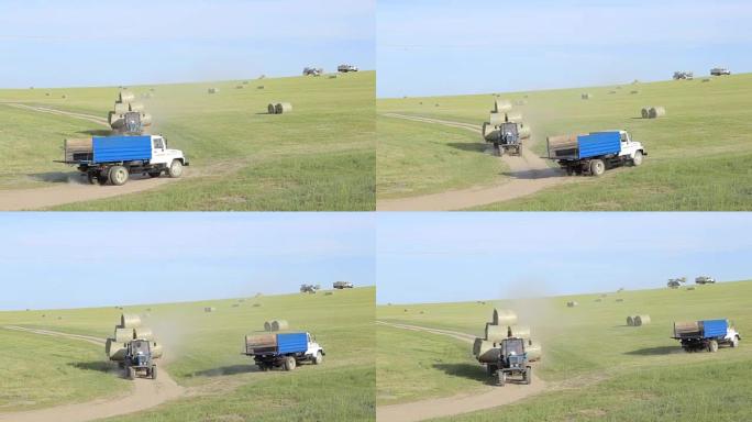 拖拉机在野外收集切好的干草滚动