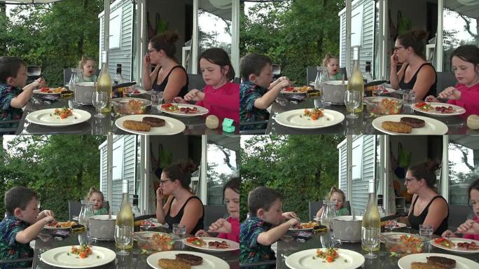 有小孩的家庭在户外用餐