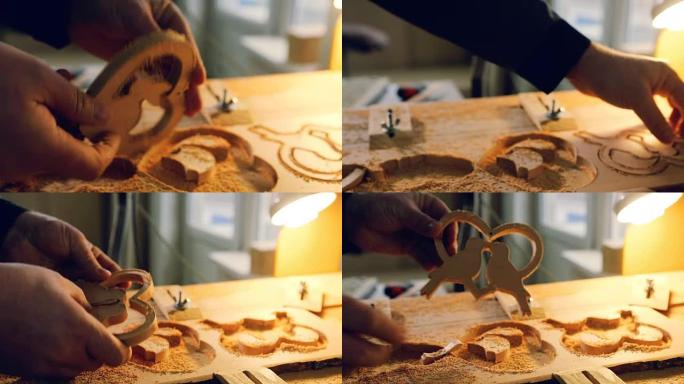 带钻头的木材切割机正在切割木制模具