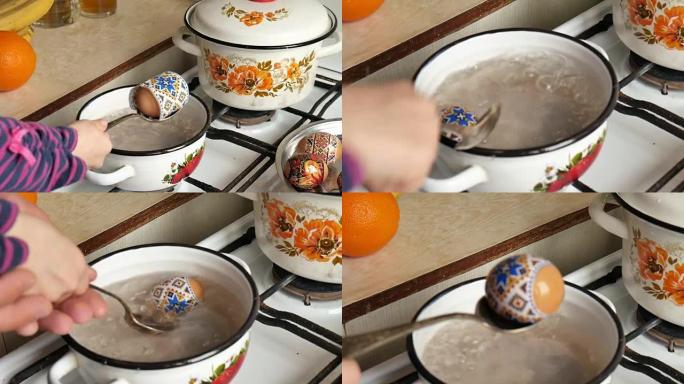 复活节传统。教孩子在厨房里画鸡蛋，用开水。用热取芯器染色复活节彩蛋的方法。新技术，教孩子给鸡蛋染色。