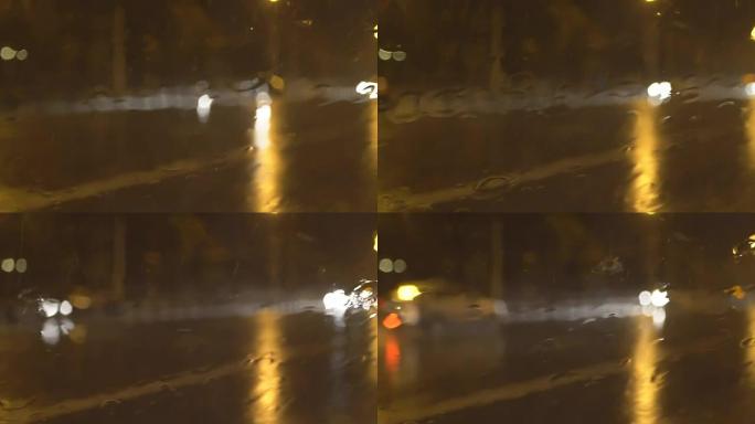 倾盆大雨中夜间交通的慢动作视频