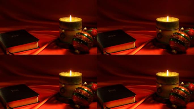 红色背景上的圣经和蜡烛视频