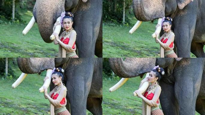 清迈克里克有大象的亚洲妇女。