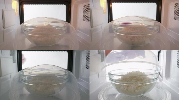 用塑料板盖的煮熟的白米饭在微波炉中加热