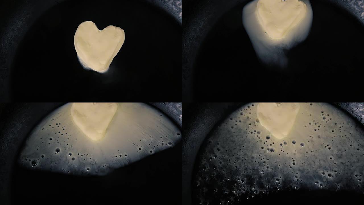 热锅上心形融化的黄油-特写俯视图