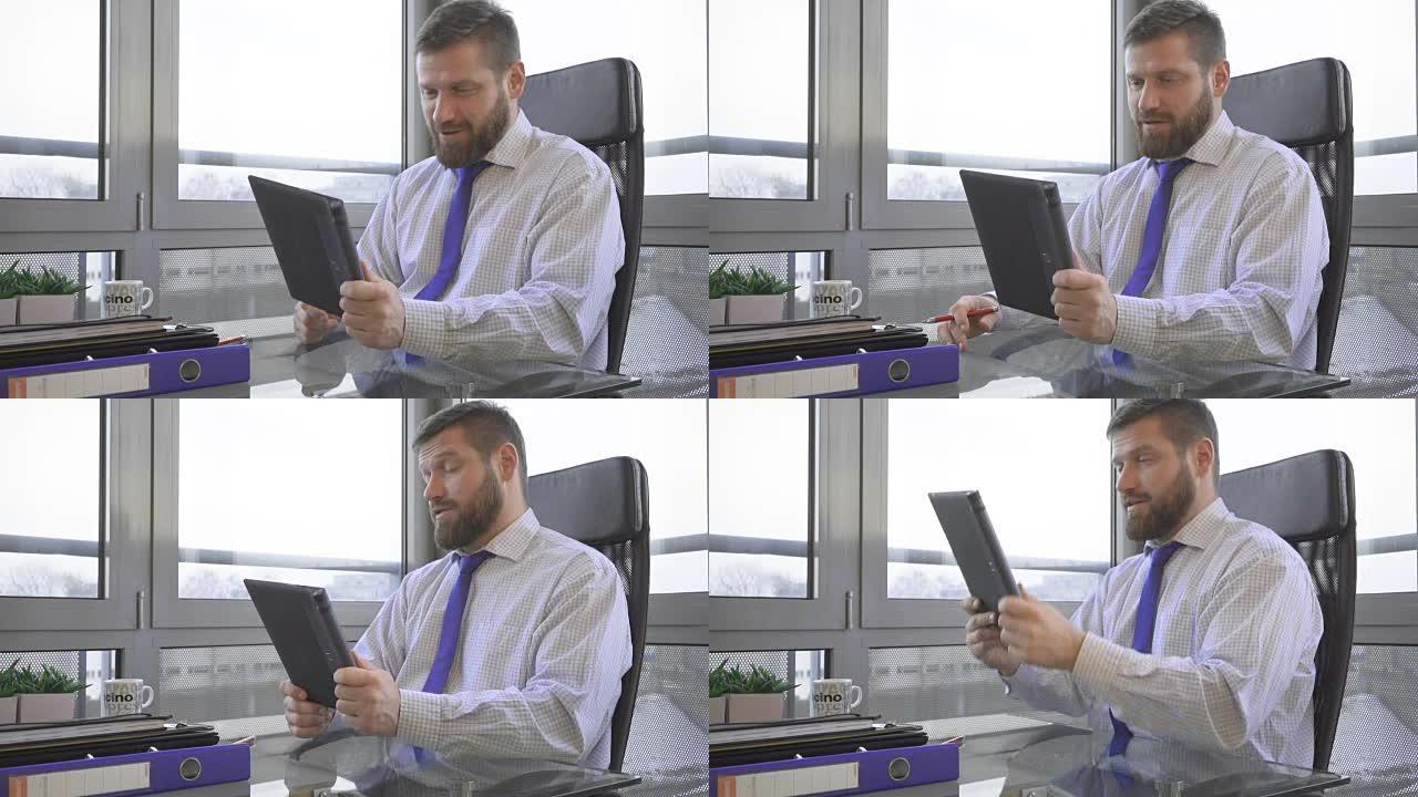 商人接听视频电话，平板电脑应用程序上的社交媒体，办公室