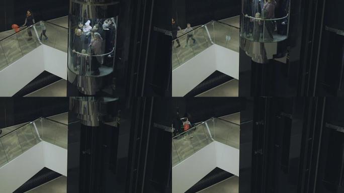 人们在购物中心的电梯上