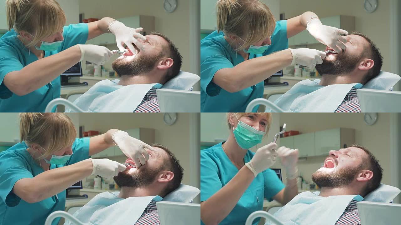 牙医拔掉病人的牙齿，看着镜头。近距离拍摄。