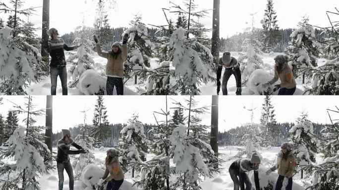 情侣冬季森林行走男女扔雪在雪公园玩得开心