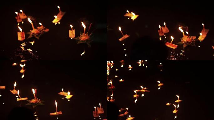 泰国清迈的Loi kathong节。手动释放浮动装饰篮子和蜡烛