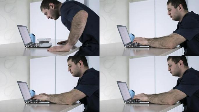 医生坐在计算机上，在笔记本电脑键盘上输入医学杂志