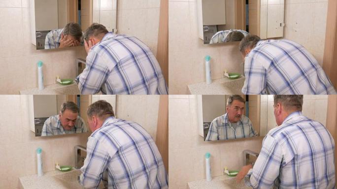 老人在浴缸里用肥皂洗脸。手术后，他用水冲洗脸部。纯度的概念